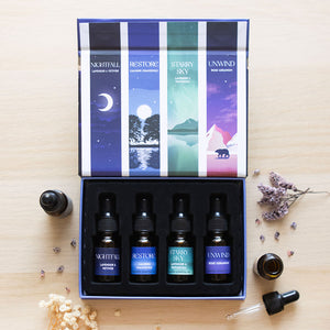 Lifestyle image of a set of blended essential oils in a beautiful gift box from the sleep collection.