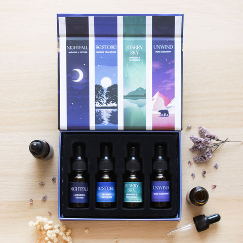 Lifestyle image of a set of blended essential oils in a beautiful gift box from the sleep collection.