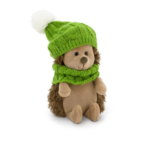 cute soft toy hedgehog wearing a green hat and matching snood, soft plush toy suitable for adults and children.