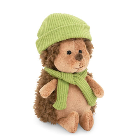 Hedgehog soft toy wearing a green hat and scarf, soft plush toy suitable for gifting.