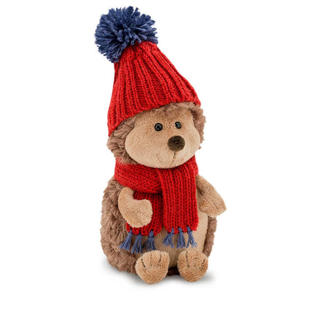 Cute hedgehog wearing a red knitted hate with a matching scarf, soft to touch and perfect for gifting.